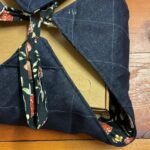 Quilted denim side and mushroom-print ties on a casserole carrier